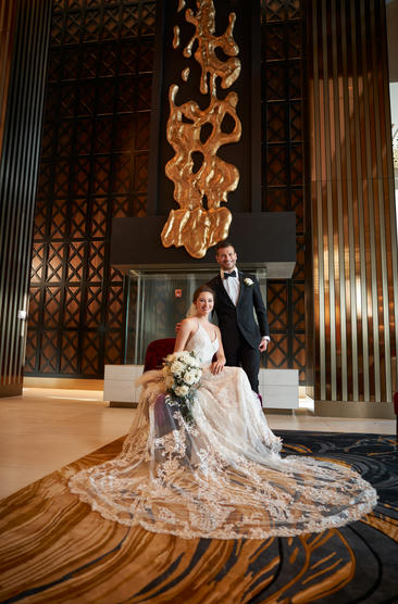 Bride and groom posed in Wind Creek Bethlehem lobby